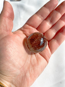 Illuminating Red Rutilated Quartz Sphere